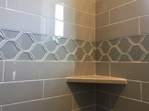 Tile installation on the wall of bathroom| Barrett Floors
